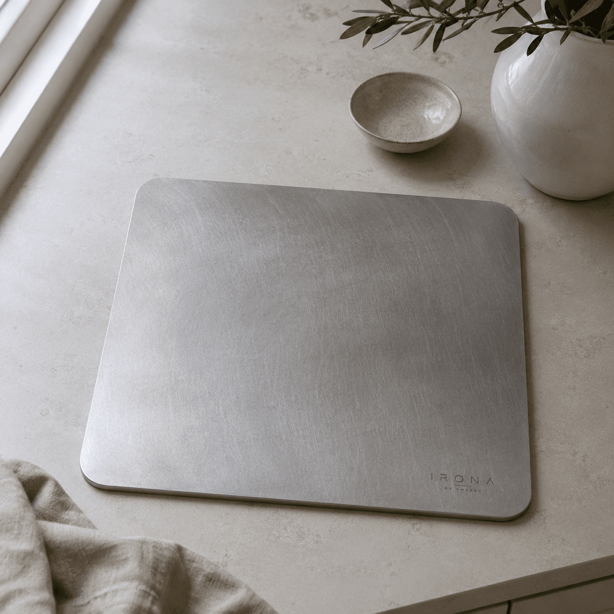 Irona 38 carbon steel baking plate on a kitchen counter