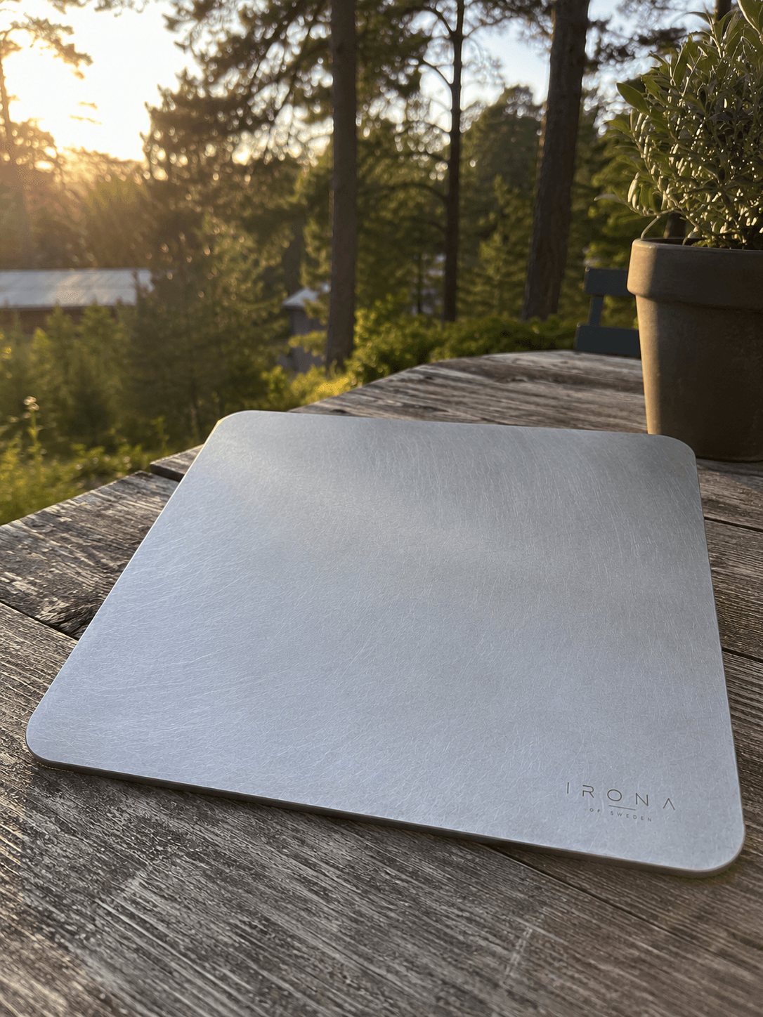 Irona 38 carbon steel baking plate on an outdoor table at sunset